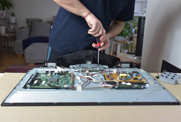 LED television being repaired on a workbench