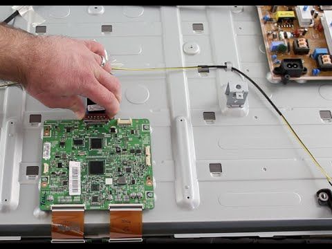 Close-up of a television motherboard under repair